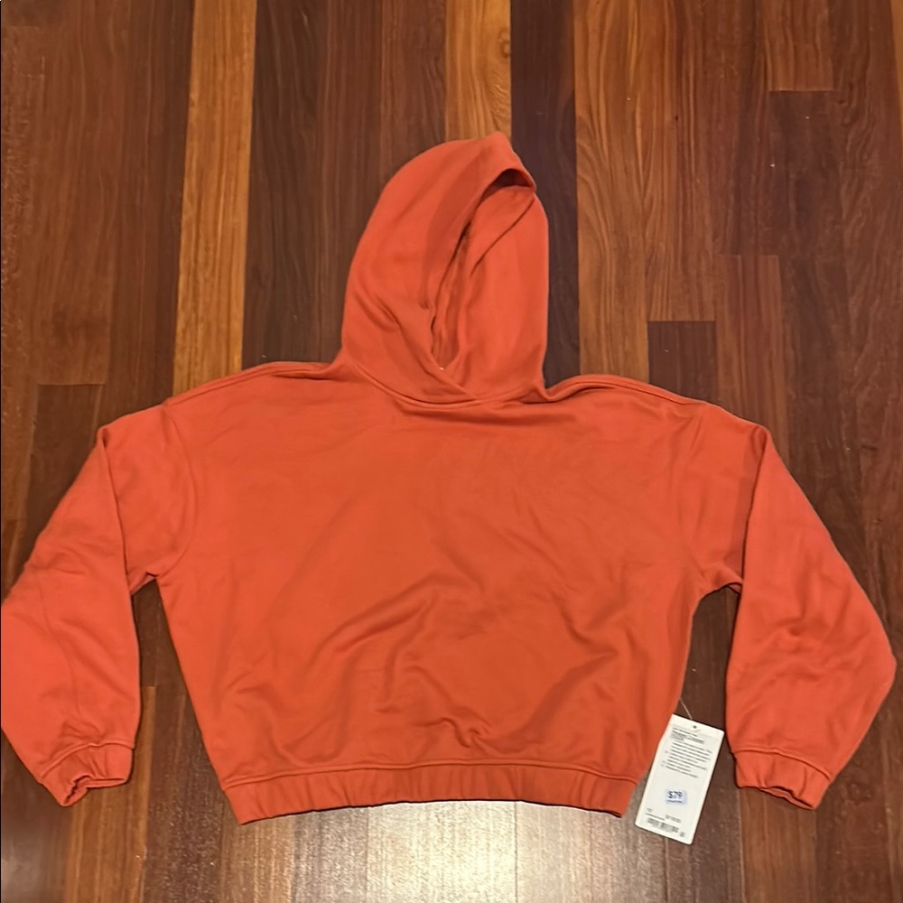 lululemon athletica Orange Pullover Hoodie with Long Sleeves and Prominent Hood